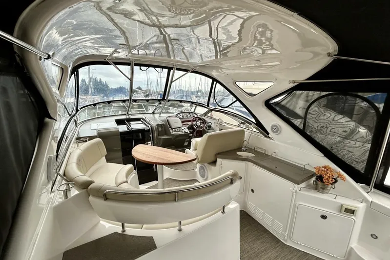  Yacht Photos Pics Luxurious interior of 2011 Regal 38 Express yacht with seating and helm.