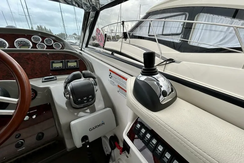  Yacht Photos Pics Cockpit of 2011 Regal 38 Express yacht with Garmin navigation system and control panel.