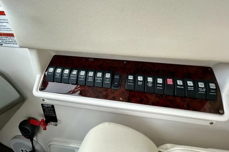  Yacht Photos Pics Control panel of a 2011 Regal 38 Express boat with labeled switches.