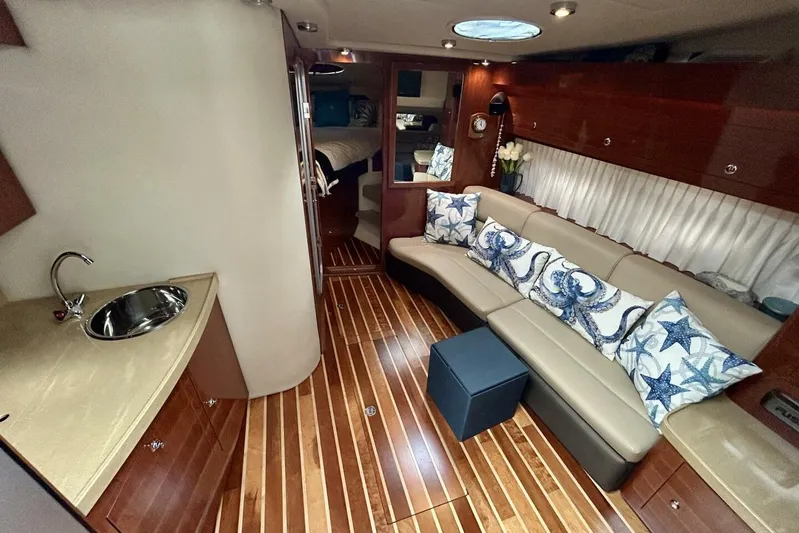  Yacht Photos Pics Luxurious interior of 2011 Regal 38 Express yacht with elegant seating and wooden flooring.