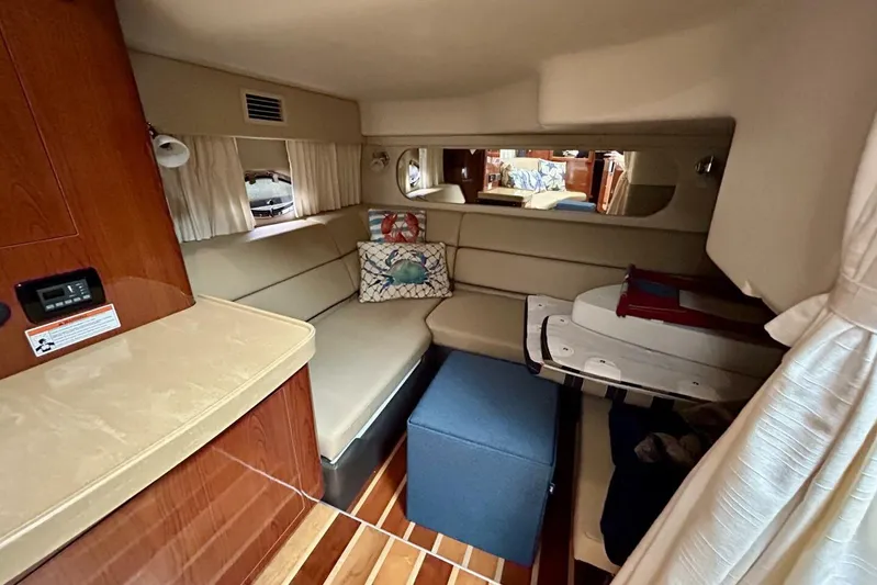  Yacht Photos Pics Luxurious interior of 2011 Regal 38 Express yacht with cozy seating and elegant decor.