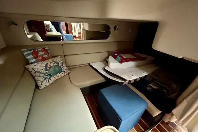  Yacht Photos Pics Cozy interior of 2011 Regal 38 Express yacht with nautical-themed pillows.