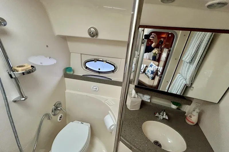  Yacht Photos Pics 2011 Regal 38 Express yacht bathroom with sink, toilet, and mirror.