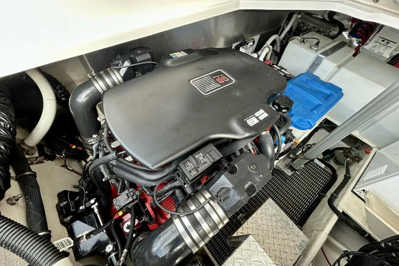  Yacht Photos Pics Engine compartment of a 2011 Regal 38 Express boat, showcasing a powerful engine setup.