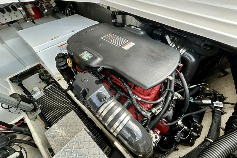  Yacht Photos Pics Engine compartment of a 2011 Regal 38 Express boat, showcasing detailed mechanical components.