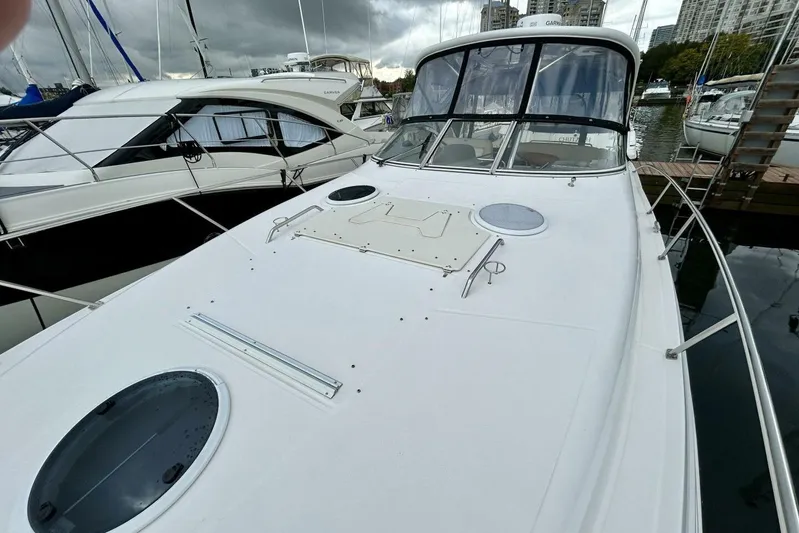  Yacht Photos Pics 2011 Regal 38 Express yacht docked, featuring sleek design and spacious deck.