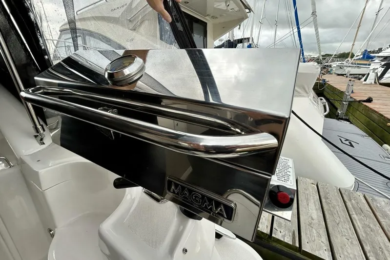  Yacht Photos Pics Stainless steel grill on 2011 Regal 38 Express yacht, docked at marina.