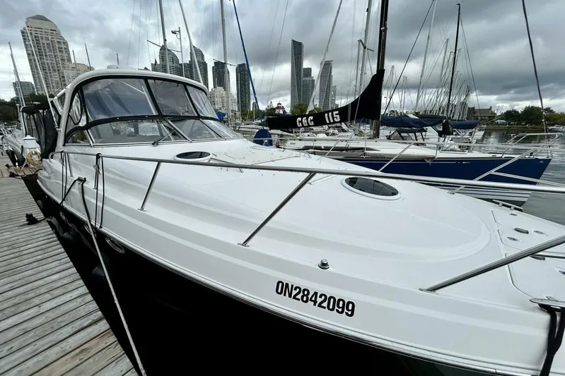  Yacht Photos Pics 2011 Regal 38 Express yacht docked at marina with city skyline backdrop.