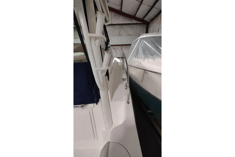 Yacht Photos Pics 2015 Boston Whaler 285 Conquest in storage, showcasing side view and railings.