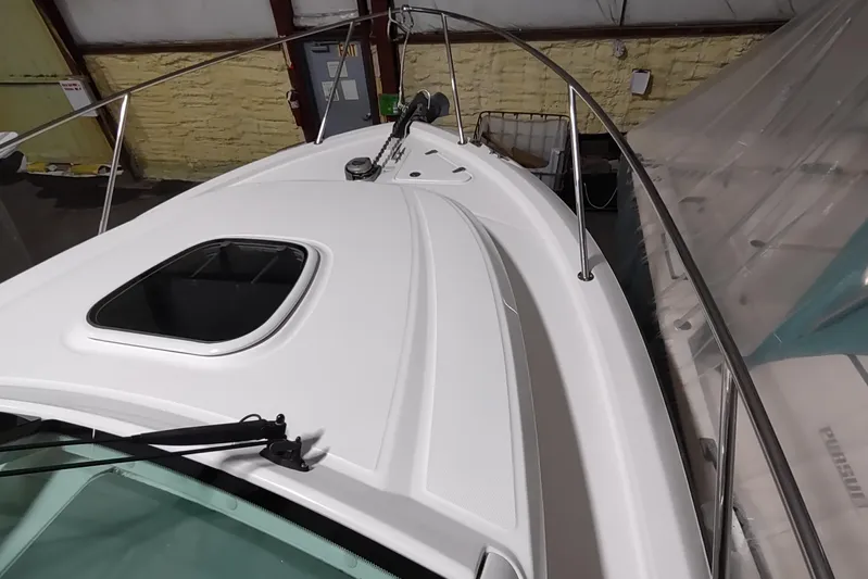  Yacht Photos Pics 2015 Boston Whaler 285 Conquest boat deck with hatch and railing in storage.