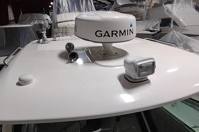  Yacht Photos Pics 2015 Boston Whaler 285 Conquest boat with Garmin radar and spotlight on deck.