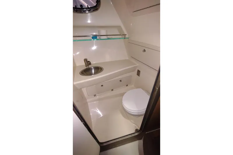  Yacht Photos Pics 2015 Boston Whaler 285 Conquest boat bathroom with sink and toilet.