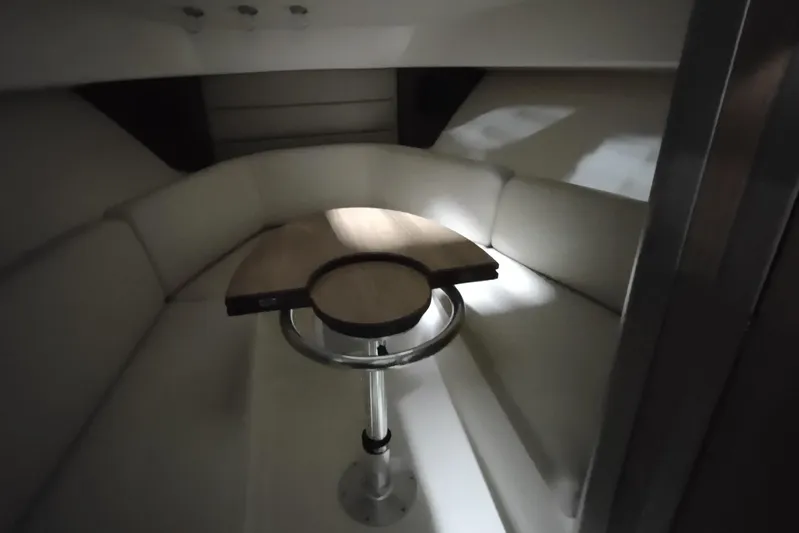  Yacht Photos Pics Interior cabin of 2015 Boston Whaler 285 Conquest with seating and table.
