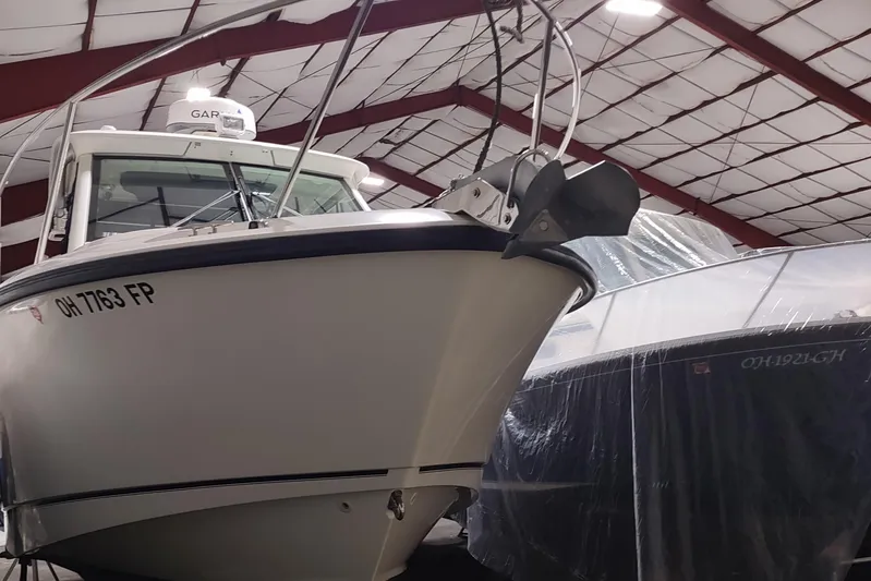  Yacht Photos Pics 2015 Boston Whaler 285 Conquest boat in indoor storage facility.