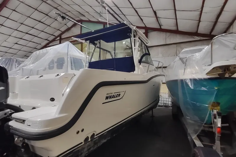  Yacht Photos Pics 2015 Boston Whaler 285 Conquest boat in storage, covered and protected indoors.