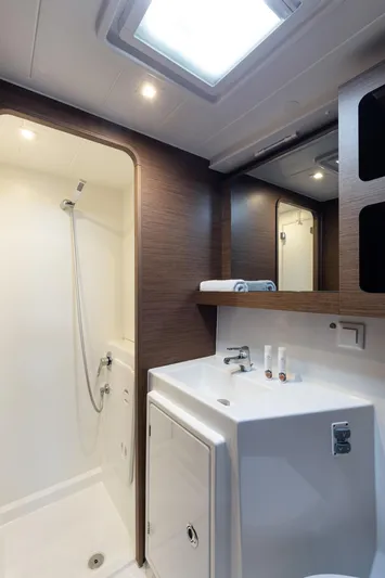  Yacht Photos Pics Modern bathroom interior of 2020 Lagoon 42 yacht with shower and sink.