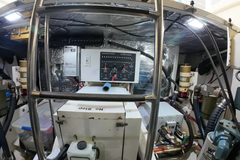 Sun Baked Yacht Photos Pics Engine room of 1999 Tiara Yachts 3500 Express with control panel and equipment.