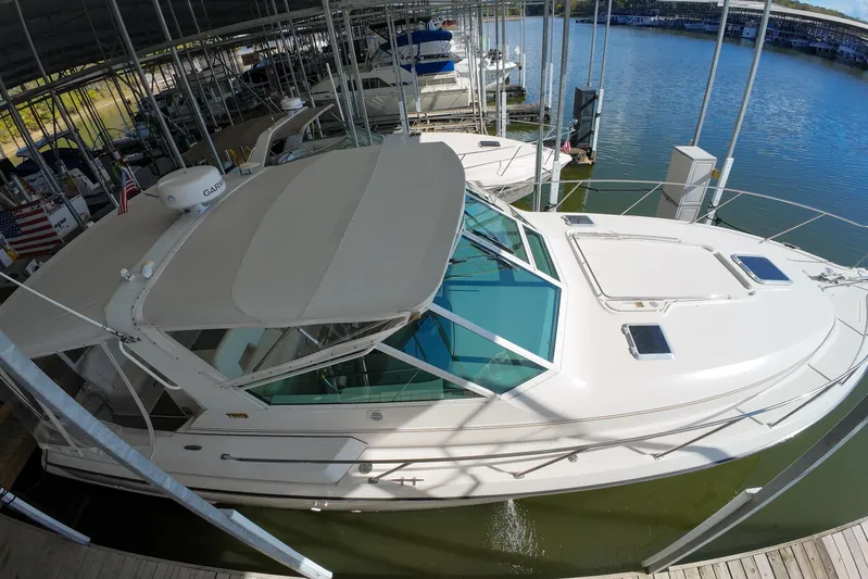 Sun Baked Yacht Photos Pics 1999 Tiara Yachts 3500 Express docked in a marina, top view.