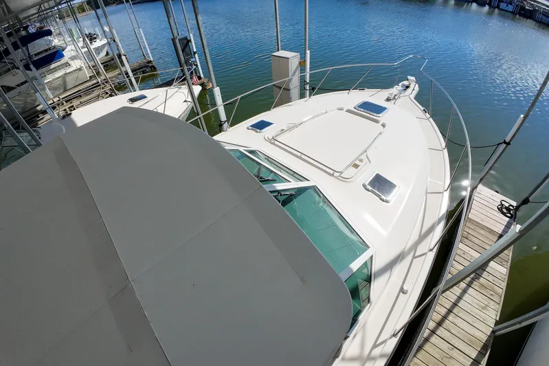 Sun Baked Yacht Photos Pics 1999 Tiara Yachts 3500 Express docked at marina, aerial view.