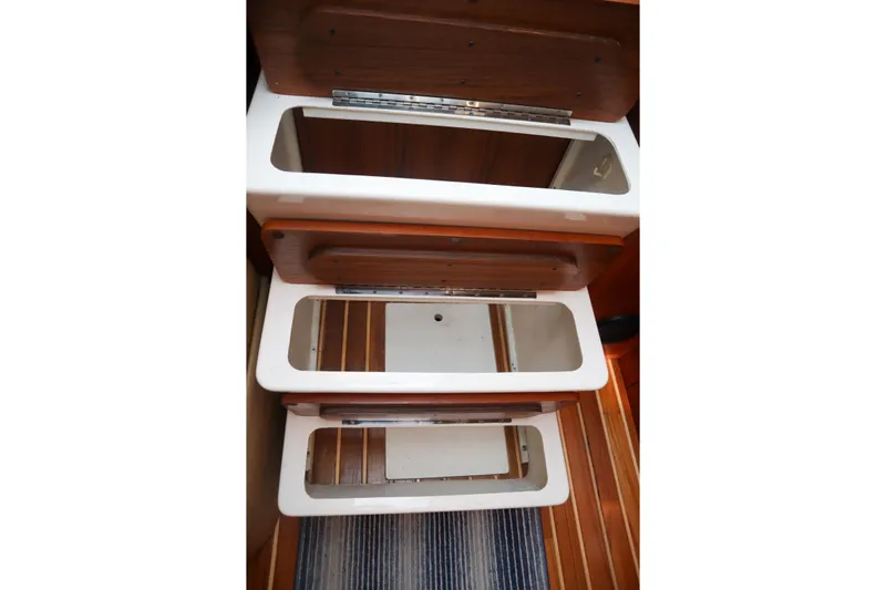 Sun Baked Yacht Photos Pics Interior storage compartments on a 1999 Tiara Yachts 3500 Express boat.