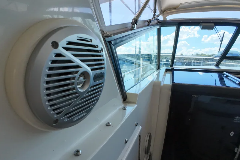 Sun Baked Yacht Photos Pics 1999 Tiara Yachts 3500 Express interior with speaker and window view.