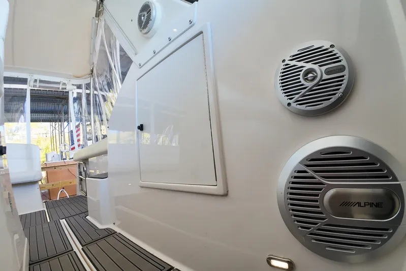 Sun Baked Yacht Photos Pics 1999 Tiara Yachts 3500 Express interior with Alpine speakers and sleek design.