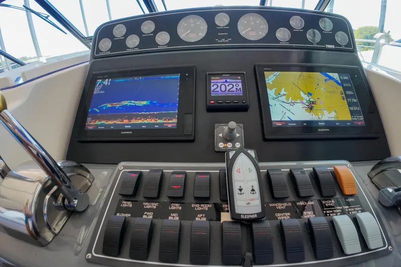 Sun Baked Yacht Photos Pics 1999 Tiara Yachts 3500 Express dashboard with navigation and control panels.