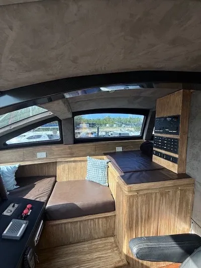 Mia Yacht Photos Pics Interior of a 2009 Custom Contenzo Eagle 90 with wood paneling.