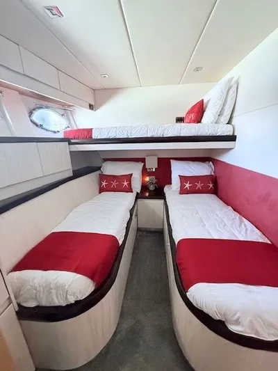 Mia Yacht Photos Pics Interior of a 2009 Custom Contenzo Eagle 90 yacht with red and white bedding.
