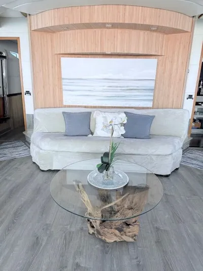 Mia Yacht Photos Pics Elegant living room with glass coffee table and modern decor.