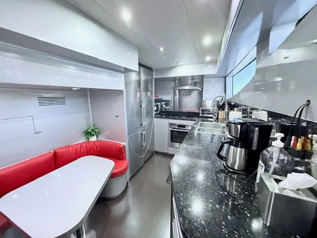 Mia Yacht Photos Pics Modern yacht kitchen with red seating, Contenzo Eagle 90, 2009.