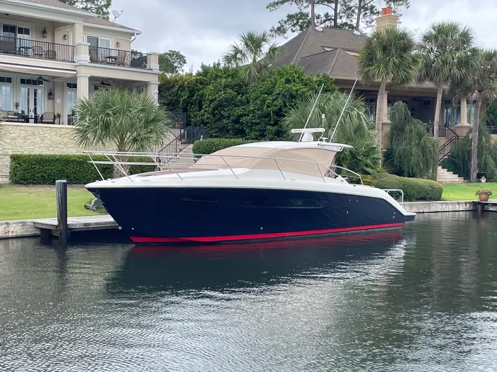 Sea Y'all III Yacht Photos Pics 2014 Pursuit SC 365i Sport Coupe docked by waterfront homes.