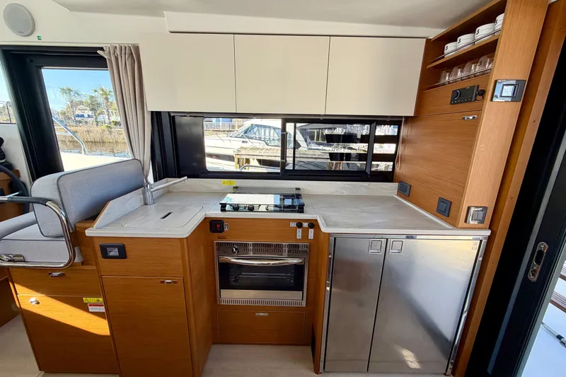  Yacht Photos Pics Modern kitchen interior of 2026 Beneteau Swift Trawler 37 Fly yacht.
