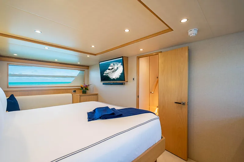 Marybelle Yacht Photos Pics Luxurious bedroom in 2017 Viking 82 Cockpit Motor Yacht with ocean view and modern decor.