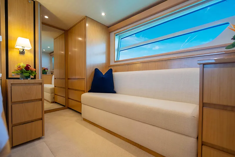 Marybelle Yacht Photos Pics Luxurious interior of 2017 Viking 82 Cockpit Motor Yacht with elegant wood finish.