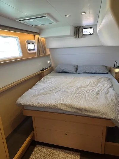 Angels Share Yacht Photos Pics Cozy bedroom interior of 2015 Lagoon 450 F yacht with modern design and natural light.