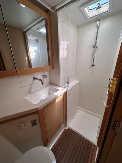 Angels Share Yacht Photos Pics Modern bathroom in 2015 Lagoon 450 F yacht with shower and sink.