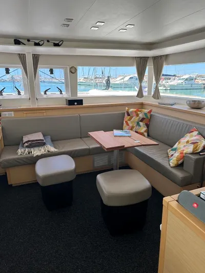 Angels Share Yacht Photos Pics Interior of 2015 Lagoon 450 F yacht with cozy seating and colorful cushions.