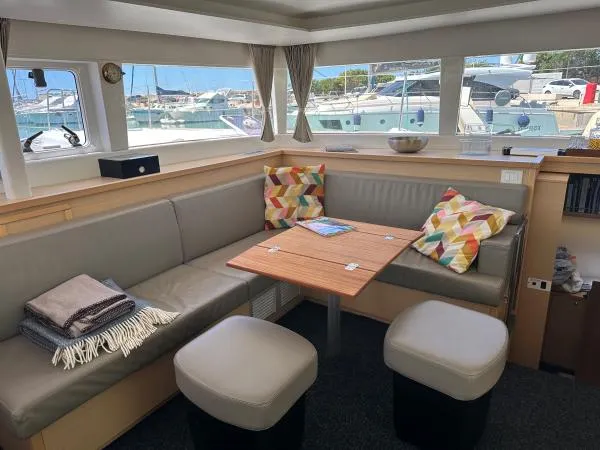 Angels Share Yacht Photos Pics Interior of 2015 Lagoon 450 F catamaran with cozy seating and colorful cushions.