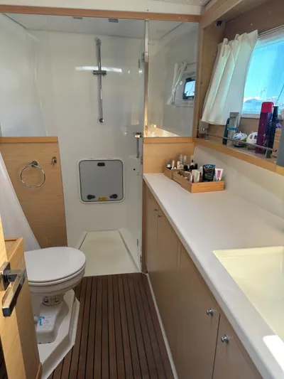 Angels Share Yacht Photos Pics Luxurious bathroom interior of 2015 Lagoon 450 F yacht with shower and vanity.