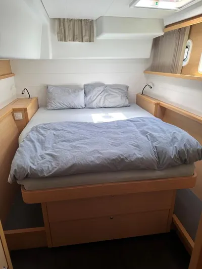 Angels Share Yacht Photos Pics Cozy bedroom interior of 2015 Lagoon 450 F yacht with double bed and natural light.