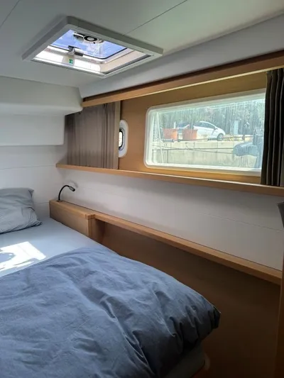 Angels Share Yacht Photos Pics Interior cabin of 2015 Lagoon 450 F catamaran with bed and window view.