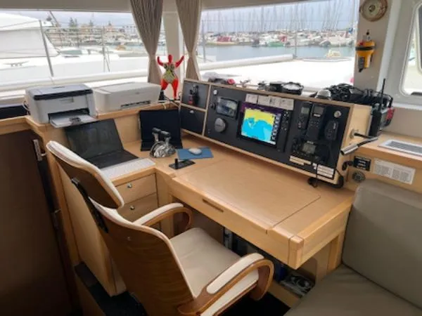 Angels Share Yacht Photos Pics Navigation station inside 2015 Lagoon 450 F catamaran with control panel and office setup.