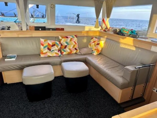 Angels Share Yacht Photos Pics Interior of 2015 Lagoon 450 F yacht with cozy seating and colorful pillows.