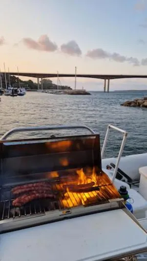 Angels Share Yacht Photos Pics Barbecue on Lagoon 450 F yacht with scenic bridge and sunset view, 2015 model.