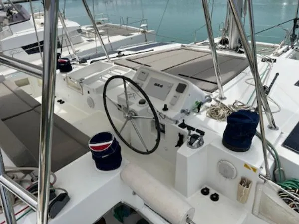 Angels Share Yacht Photos Pics 2015 Lagoon 450 F yacht cockpit with steering wheel and navigation equipment.
