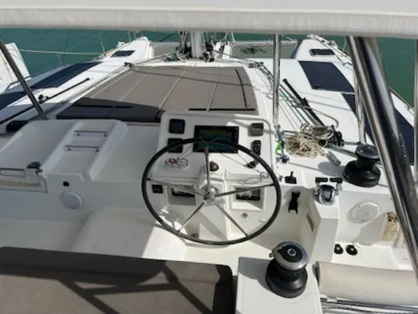 Angels Share Yacht Photos Pics 2015 Lagoon 450 F catamaran cockpit with steering wheel and navigation equipment.