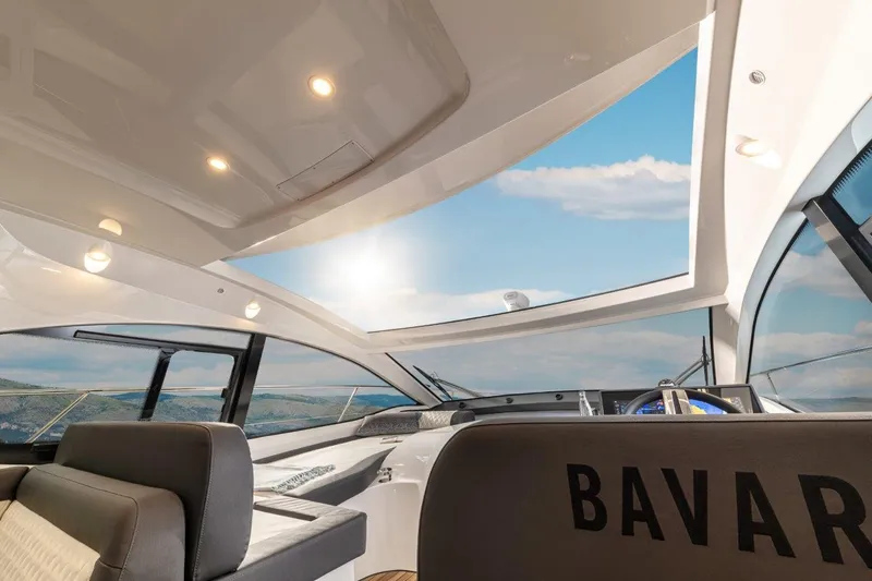 Inventory Clearance Yacht Photos Pics 2023 Bavaria SR41 COUPE interior with panoramic sunroof and luxurious seating.