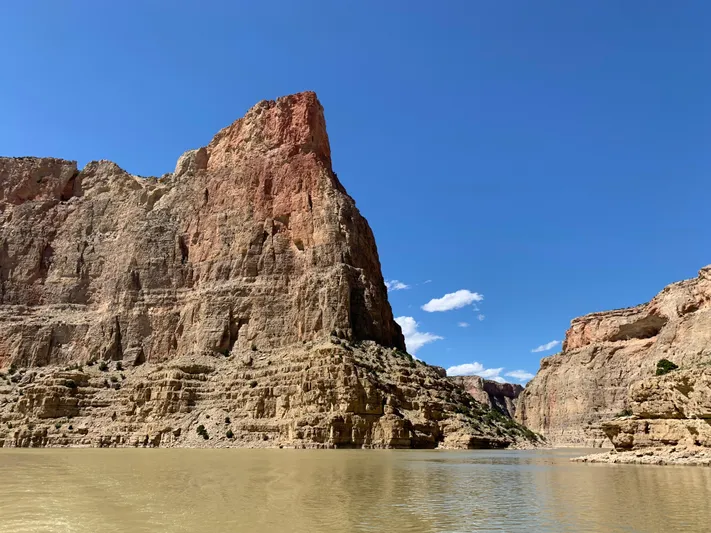 Mv Belle Yacht Photos Pics Scenic canyon view with towering cliffs and river under clear blue sky.