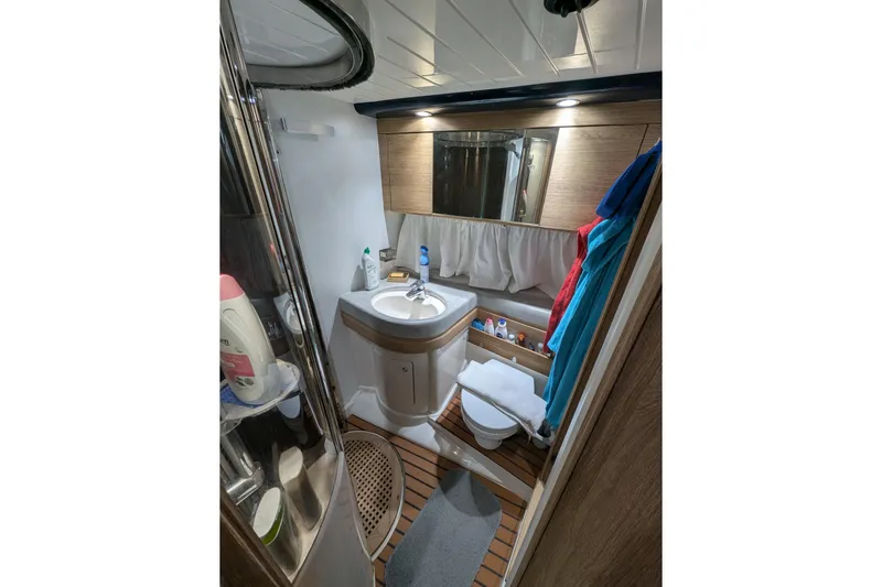  Yacht Photos Pics Bathroom interior of 1998 Princess 52 Flybridge Motor Yacht, featuring modern amenities and wooden accents.